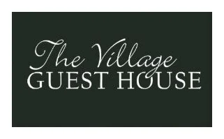 The Village Guest House logo